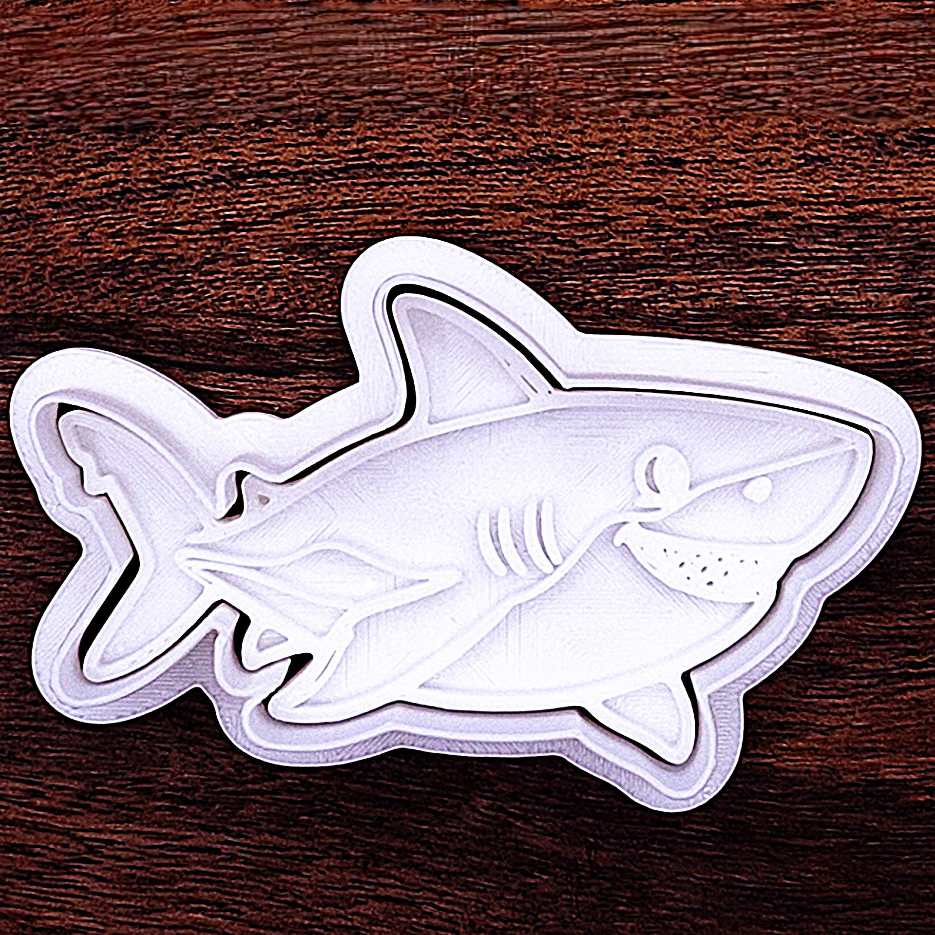 Shark cookie cutter with friendly face stamp. Perfect for fun, no-fuss decorating for birthdays or shark week fun.