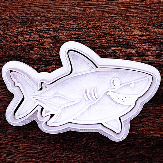 Shark cookie cutter with friendly face stamp. Perfect for fun, no-fuss decorating for birthdays or shark week fun.