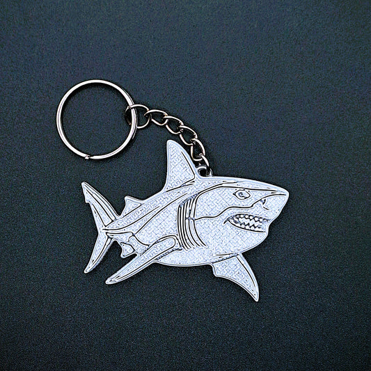Front view of silver shark keychain charm. Handmade eco-friendly PLA plastic, perfect ocean-themed gift or accessory for shark and marine life lovers.