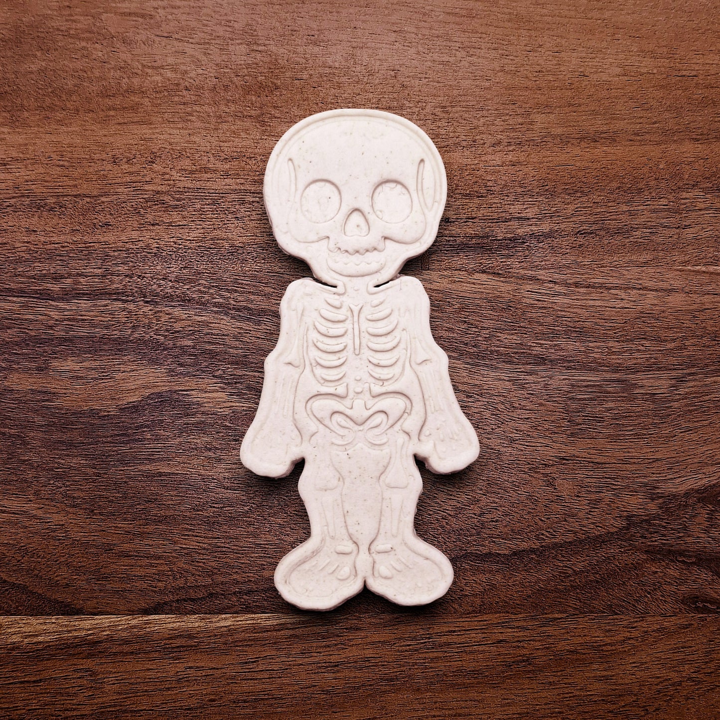 Stamped skeleton cookie dough with bone details. Perfect for Halloween cookies or creepy edible crafts.