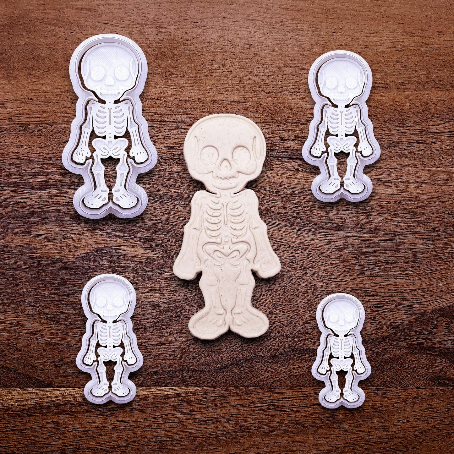 Skeleton cookie cutters with matching stamps that adds bone and skull details—ideal for detailed cookies without decorating.