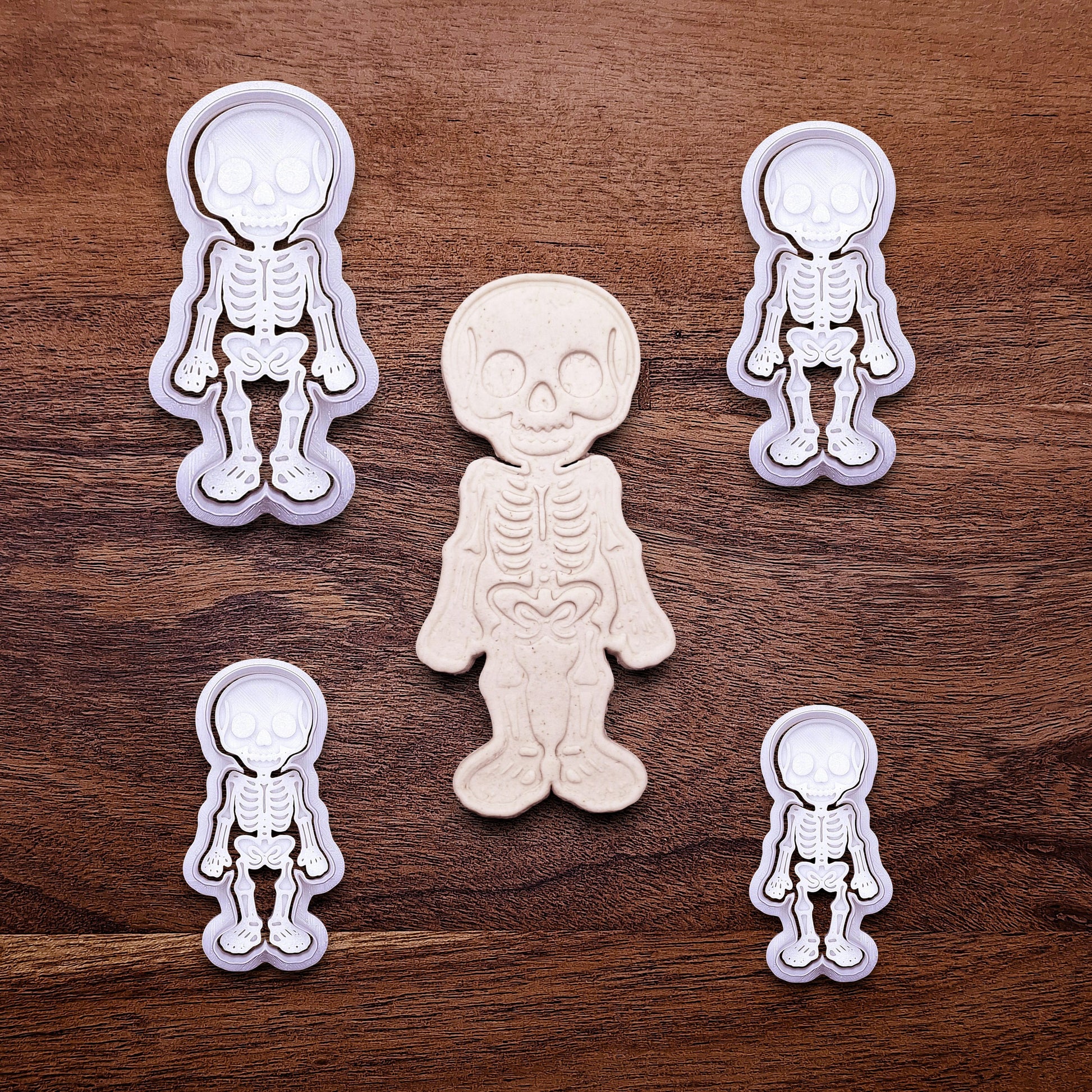 Skeleton cookie cutters with matching stamps that adds bone and skull details—ideal for detailed cookies without decorating.