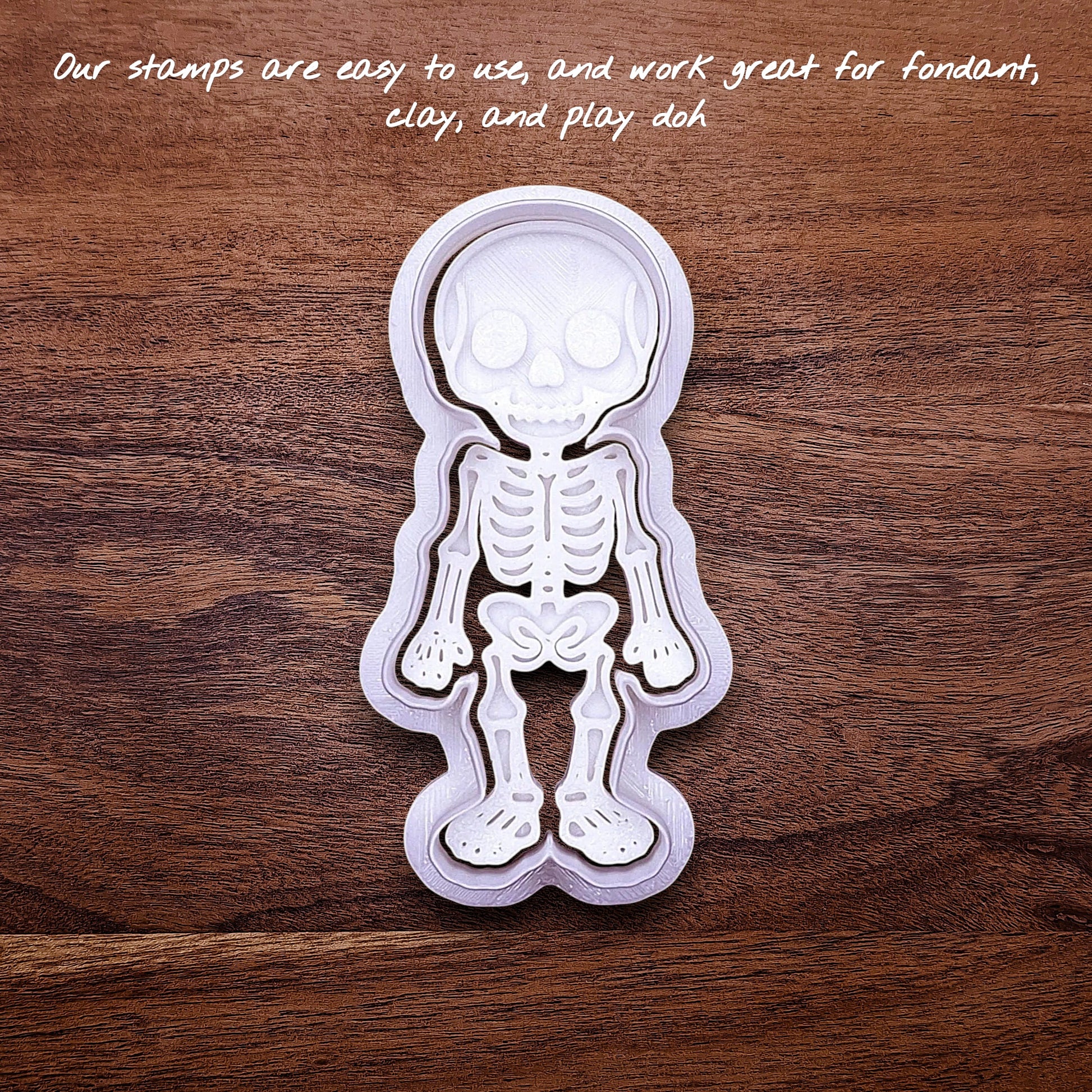 Front view of skeleton cookie cutter with stamp, perfect for outline cookies, fondant toppers, or Halloween crafts.