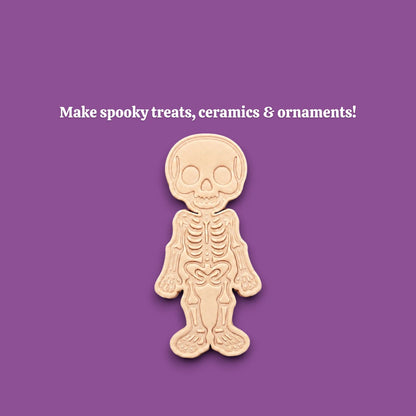 Stamped skeleton cookie dough with bone details. Perfect for Halloween cookies or creepy edible crafts.