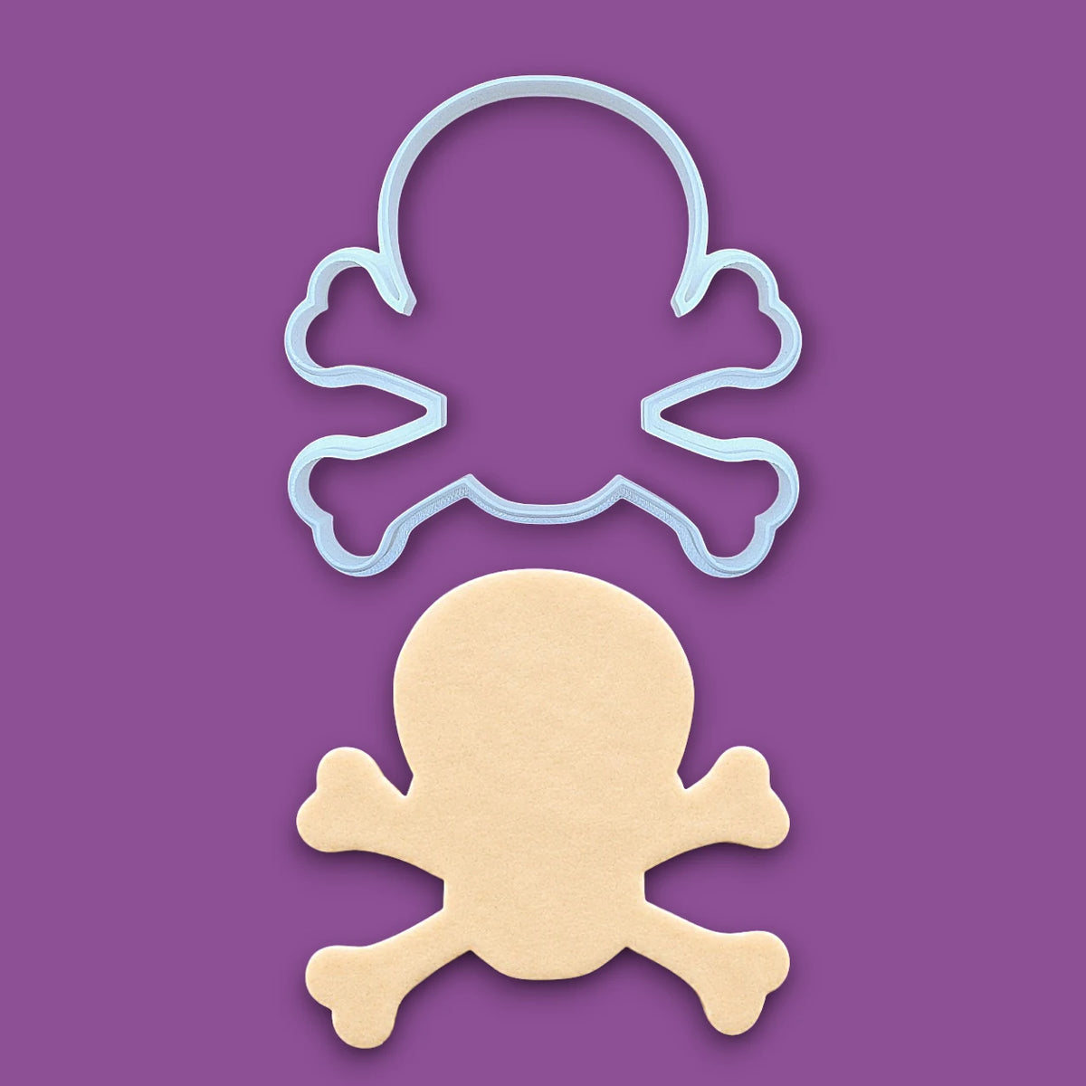 Skull and bones cookie cutter with dough cutout, customizable in 30 unique colors and handmade, perfect for beach parties, Halloween treats, under the sea treats and pirate themed birthdays.