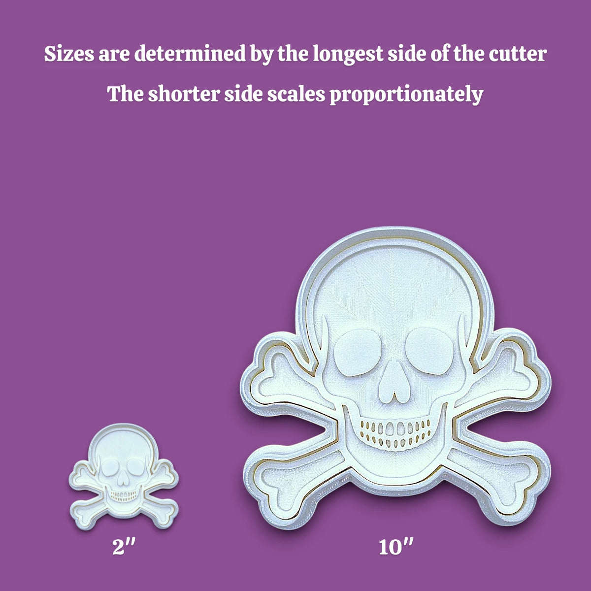 Skull and bones cookie cutter with stamp alongside a sizing guide from 2 inches to 10 inches, perfect for beach parties, Halloween treats, under the sea treats and pirate themed birthdays.