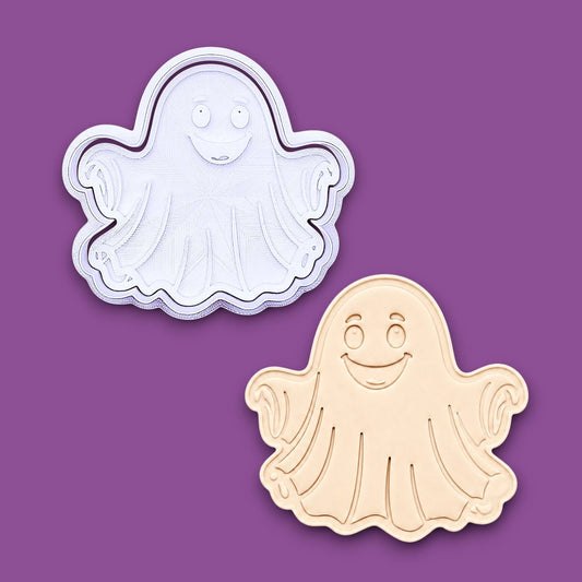 Handmade and customizable Halloween ghost cookie cutter and stamp alongside a dough cutout and imprint, great for easy fall cookie decorating and fun baking for school or family celebrations and trick or treats.