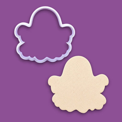 Handmade and customizable Halloween ghost cookie cutter alongside a dough cutout, great for easy fall cookie decorating and fun baking for school or family celebrations and trick or treats.