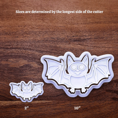 Halloween bat cookie cutters side by side to illustrate how sizing from 2 inches to 10 inches works.