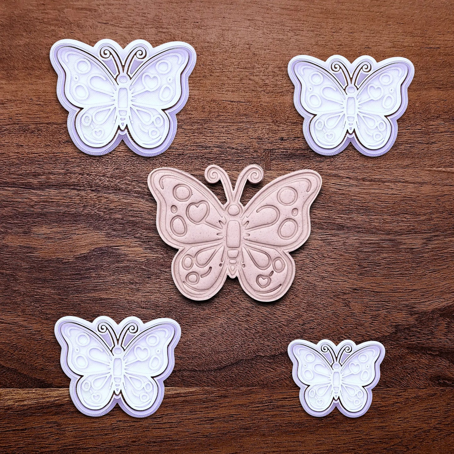 Handmade and customizable butterfly cookie cutters with stamps and dough cutout and imprint, perfect for spring baking, garden party treats, birthdays, events, weddings, fondant decorations, and whimsical cookie designs.