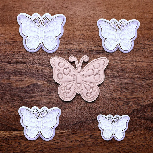 Handmade and customizable butterfly cookie cutters with stamps and dough cutout and imprint, perfect for spring baking, garden party treats, birthdays, events, weddings, fondant decorations, and whimsical cookie designs.
