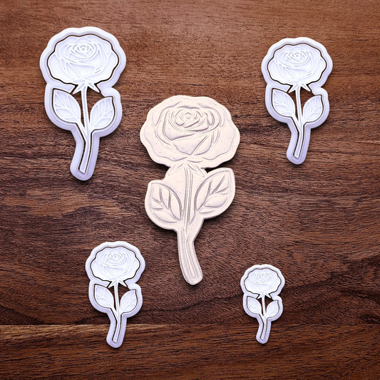 Handmade and customizable Rose Cookie Cutters and Stamps alongside a dough cutout and imprint, perfect for spring events, romantic weddings, or special occasions.