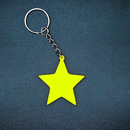 Yellow star keychain with a bold five-pointed shape, handmade from eco PLA plastic, ideal for dreamers, kids, and celestial-themed gifts.