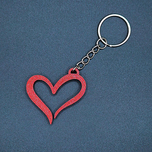 Maroon red heart keychain with smooth modern shape, a handmade and eco-friendly charm for romantic gifting or keychain personalization.