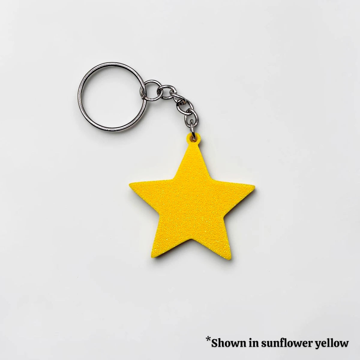 Handmade and customizable star keychain in sunflower yellow, made from eco PLA plastic, ideal for classroom prizes, rewards, events, kids, and party favors.