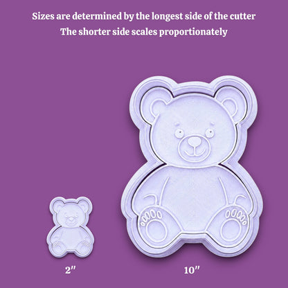 Two white teddy bear-shaped cookie cutters shown on a gray background, with text explaining size determination and labels indicating 2 inches and 10 inches.