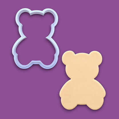 Handmade and customizable teddy bear cookie cutter alongside a dough cutout featuring a traditional plush bear shape, perfect for standout cookies at Valentine's Day parties or gifting.