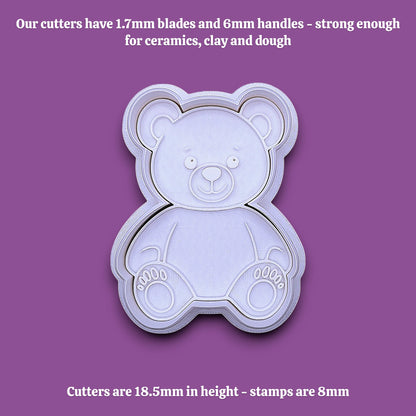 A white plastic teddy bear-shaped cookie cutter shown on a solid gray background, with black text at the top and bottom describing the cutter dimensions and suitability for baking ceramics, clay, and dough.