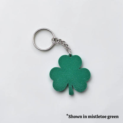 Handmade and customizable shamrock keychain in mistletoe green, perfect for St Patrick's Day party favors and gifts.