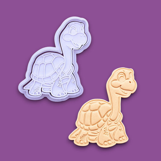 Tortoise cookie cutter with stamp alongside a dough imprint, perfect for ocean themed ceramics, clay, soap, biscuits, and fun baking projects.