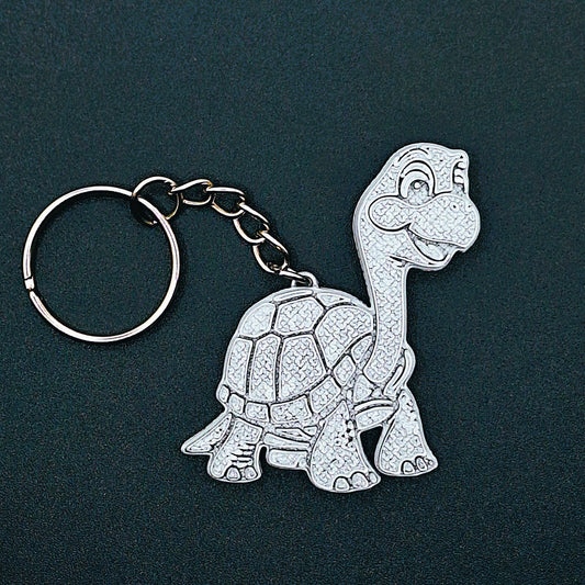 Front view of silver turtle keychain with charming design, handmade from compostable PLA plastic, a perfect marine animal gift or accessory.
