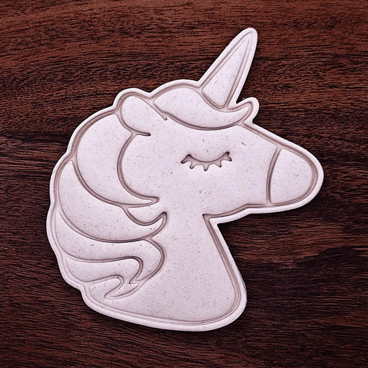 Unicorn cookie dough cutouts with detailed horn, mane, and eye stamp. Perfect for magical party cookies, fondant, or unicorn-themed bakes.