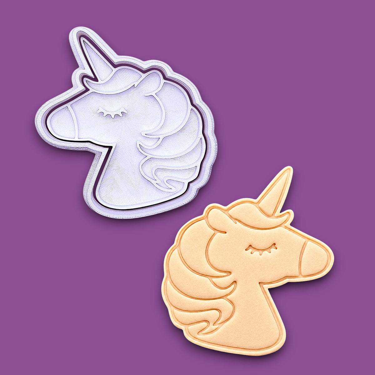 Unicorn cookie cutter and stamp alongside a dough cutout and imprint, perfect for fantasy themed bakes, ceramics and gifting.
