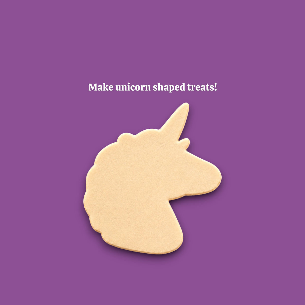 A unicorn-shaped cookie cutout on a solid purple background, with the white text 'Make unicorn shaped treats!' above it.