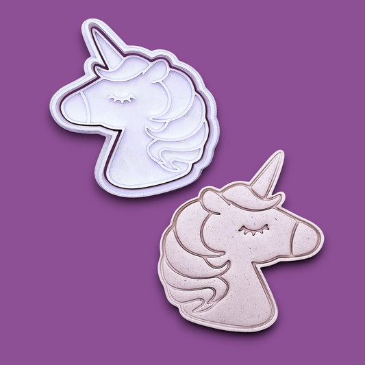 Unicorn cookie cutter and stamp alongside a dough cutout and imprint, perfect for fantasy themed bakes, ceramics and gifting.