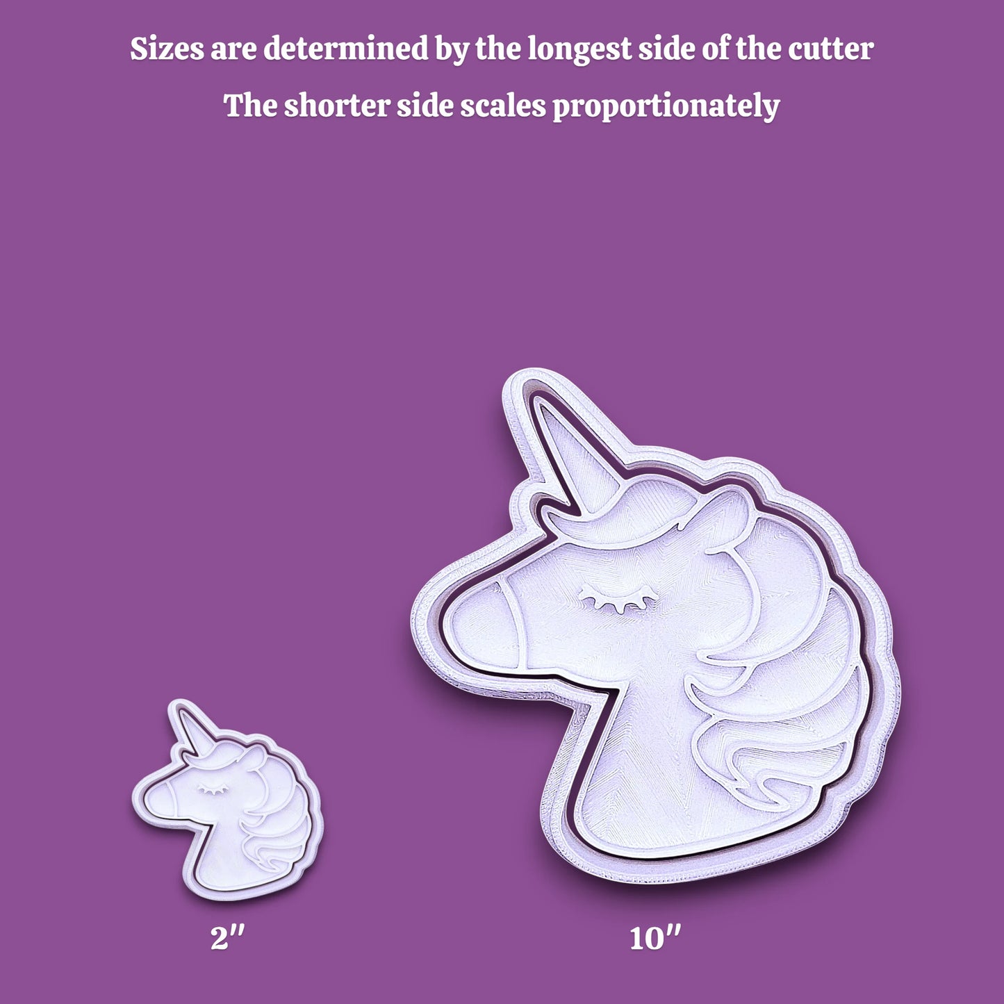 A white unicorn-shaped cutter shown in two sizes on a purple background, with text explaining that sizes are determined by the longest side of the cutter and that the shorter side scales proportionately. The larger cutter is labeled 10 inches, and the smaller one is labeled 2 inches.