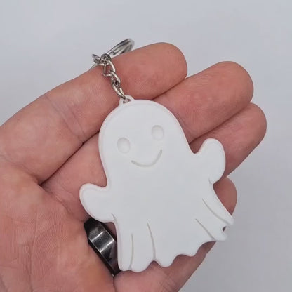 Video showing a Halloween ghost keychain from all angles, perfect for trick or trick party favors.