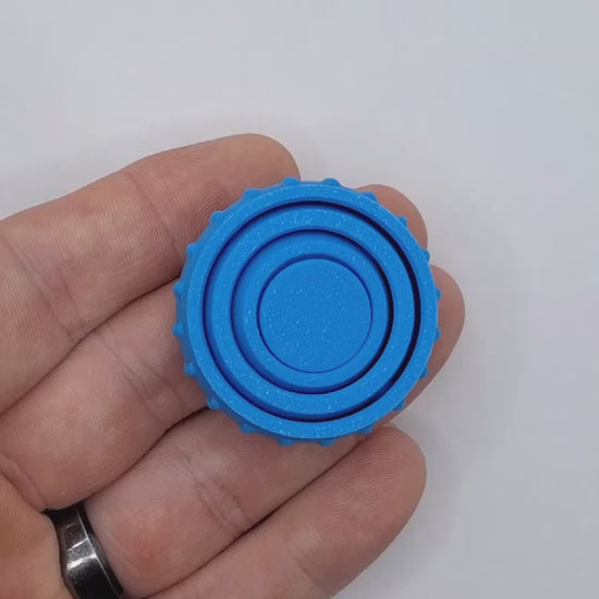 Video showing a fidget and gyro spinner, perfect for party favors, event giveaways, classroom prizes and promotional items. Customizable in 30 colors and handmade in USA.