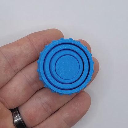 Video showing a fidget and gyro spinner, perfect for party favors, event giveaways, classroom prizes and promotional items. Customizable in 30 colors and handmade in USA.