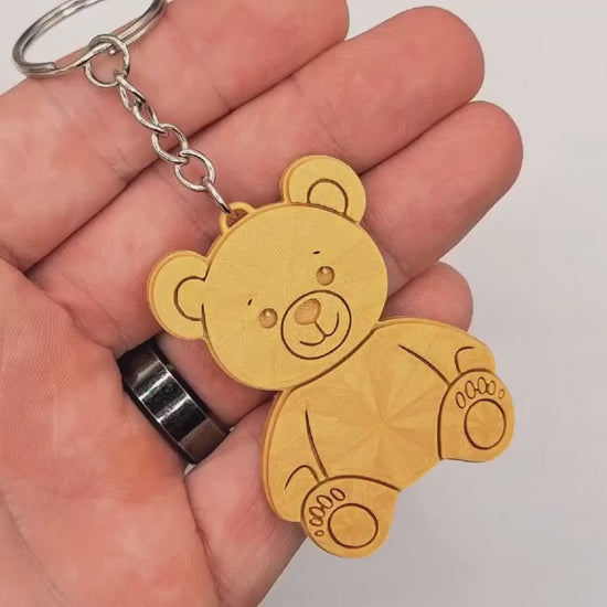 Video showing teddy bear keychain, customizable and handmade, perfect for baby showers, party favors and everyday gifts.
