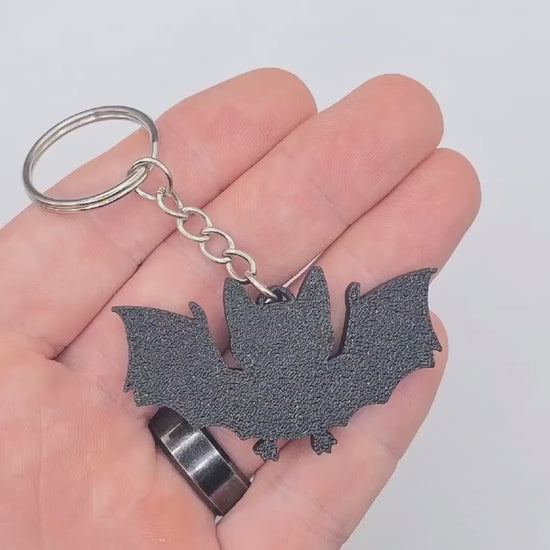Halloween bat keychain video showing the keychain in various angles, perfect for fall gifts and trick or treats.